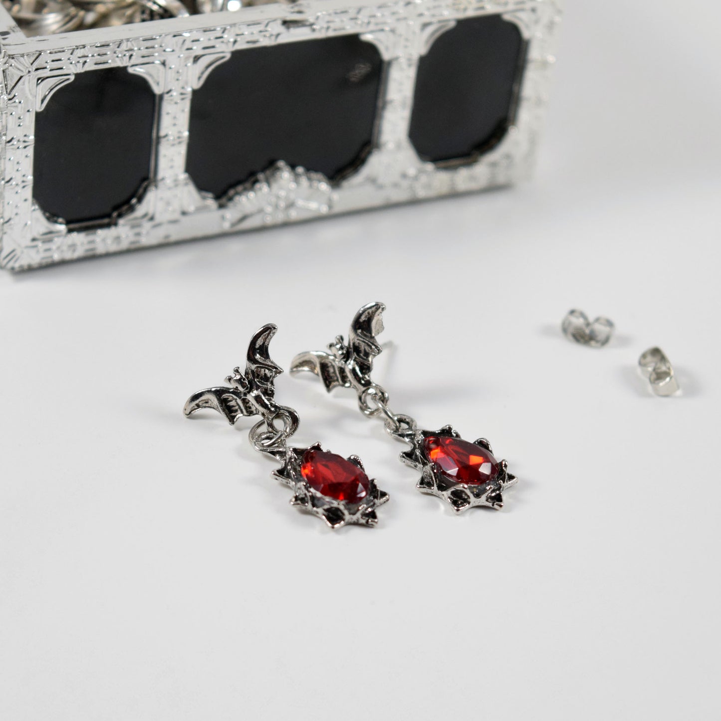 Bejeweled bat earrings