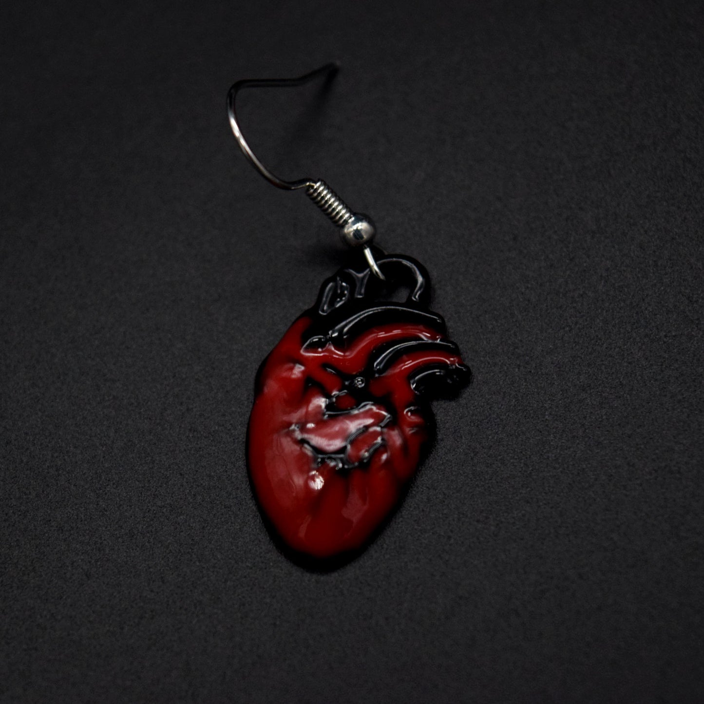 Poisened heart earrings